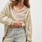 model wearing light blue washed denim with moderate distressing on the hem