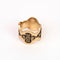 top view of brass floral scarf slide + ring