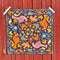 flattened navy bandana with colorful chicken print