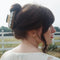model wearing white and brown geometric vintage lamp inspired hair claw