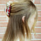 model wearing white and red rose vintage lamp inspired hair claw