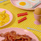 bacon shaped hair clips on a breakfast table