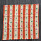 pale yellow and orange striped tea towel with green and pink dots