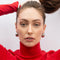 model wearing silver chunky huggie earrings
