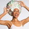 model wearing colorful 'oil slick' satin bonnet
