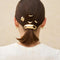 set of three gold metal pony tail pins in models hair