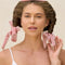 model wearing terracotta velvet heatless curling rod and ties