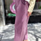 side view of model wearing dusty lilac cotton relaxed pant
