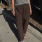 model wearing brown cotton relaxed pants