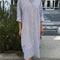 model wearing relaxed fit blue and white vertical stripe shin length shirtdress
