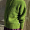 side view of model wearing artichoke green mohair cardigan