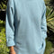 model wearing light blue relaxed fit raglan sweatshirt