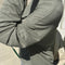 up close of model wearing sage linen blend long sleeve top