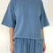 model wearing cornflower oversized tee with oversized sleeves