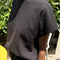 side view of model wearing dark slate relaxed fit cotton tee with muscle type sleeves and side vents