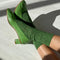 model wearing palm green pointelle socks