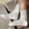 side view of model wearing cream mohair crew socks
