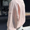 back view of model wearing baby pink relaxed fit polo sweatshirt