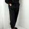side view of model wearing black french terry balloon cotton pants