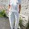model wearing vintage white relaxed fit tee with 'le bon crew' on the left bust