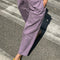 up close of model wearing dried lavender carpenter cotton pants