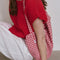 model carrying red and white gingham rectangular bag