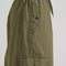 side view of model wearing green low rise parachute cargo pants with ruched bottoms