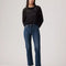 model wearing dark wash wedgie straight jeans