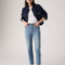 model wearing light denim wedgie straight jeans