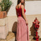 back view of model wearing red and white gingham midi skirt