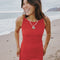 up close of model wearing pepper red crinkle tank maxi dress with open tie back