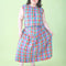 model wearing colorful plaid midi skirt with drop waist
