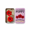 red poppy dangle earrings on gold hoops and comes in a tin holder