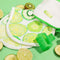 makeup eraser pro gift set includes white makeup eraser with all over kiwi print, lime green hair claw and a white and lime green zip pouch on a green ground