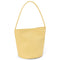 side view of pale yellow leather bucket bag