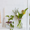 two floral arrangements with keepers at the top