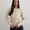model wearing ivory cardigan with cinched in waist