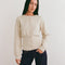 model wearing ivory cardigan with cinched in waist