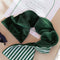 model wearing dark velvet underside of eye mask