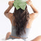 model tying matcha green weighted eye mask around their head