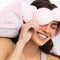 model wearing pale pink and white stripe weighted eye mask