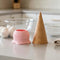 pink ice cream cone measuring cups on a counter