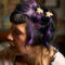 model wearing set of two white mini iridescent star shaped hair claws