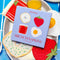 packaged set of 4 brunch linen napkins: bloody mary, strawberry, egg, and bagel with cream cheese