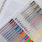 opened set of 30 glitter, metallic, pastel, neon and primary gel pens
