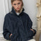 model wearing oversized high neck denim cropped jacket