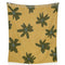 reverse side of gold throw blanket with gray flower print with smiley faces in the center