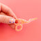 model holding pink stork scissors hair clip