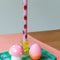 set of 2 lilac dinner candles with all over strawberry print on a table setting