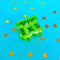 green mini bread clip mini hair claw on a blue background with gold stars